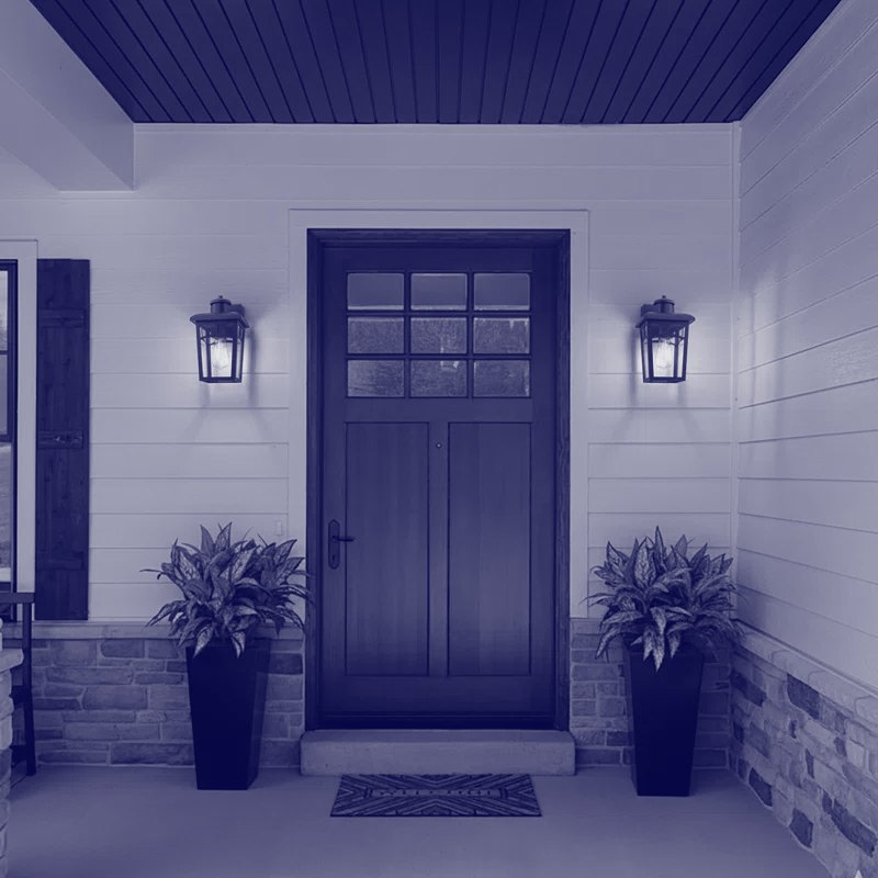 Kichler outdoor wall lanterns flanking a residential entry